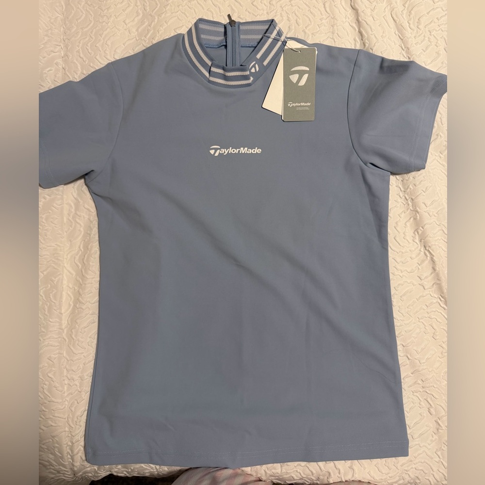 The TaylorMade TL801 women's short-sleeve mock neck golf shirt